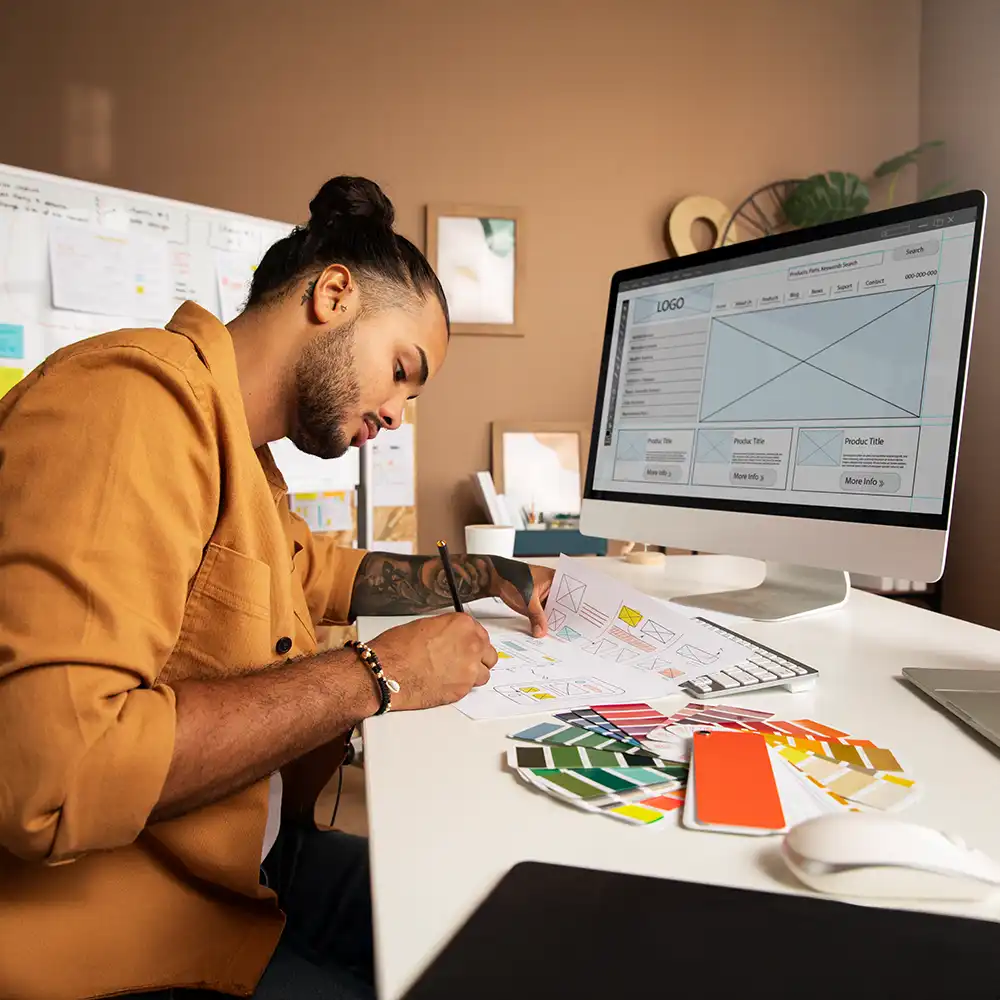 A graphic designer working on prototype for a client's website