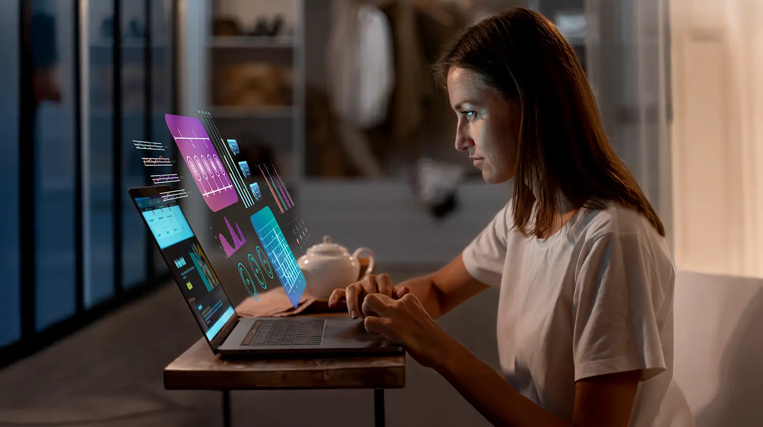 A young woman worked on a 3D hologram laptop screen